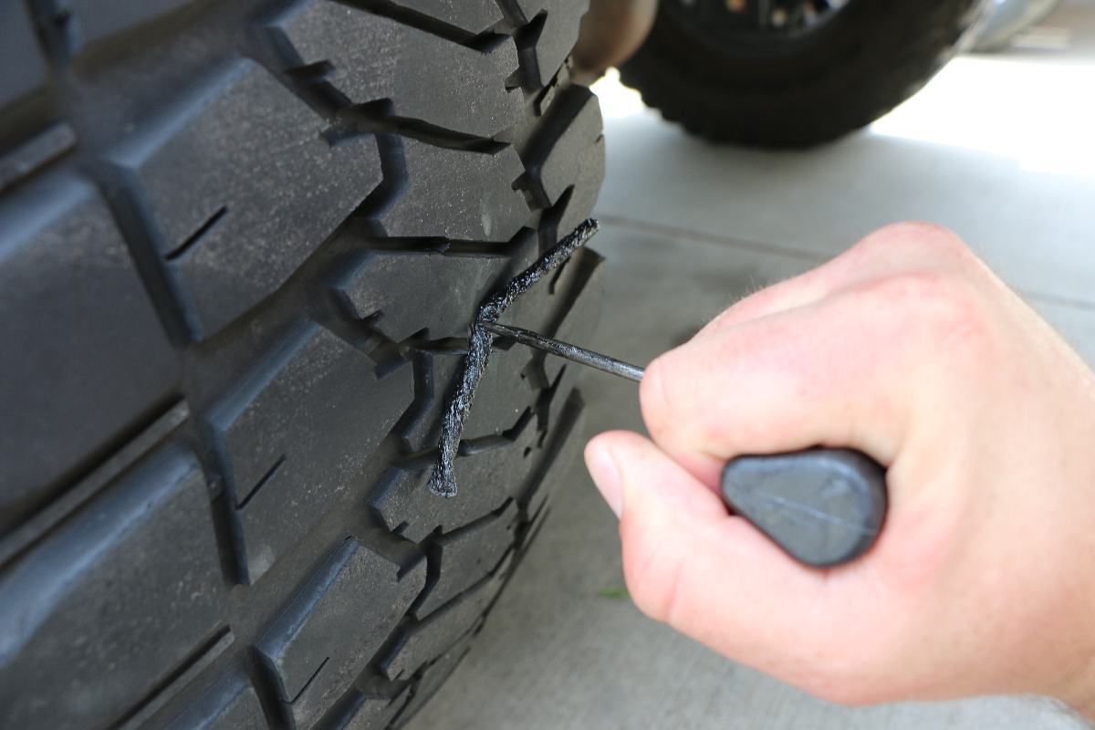 Installing a plug into a tire