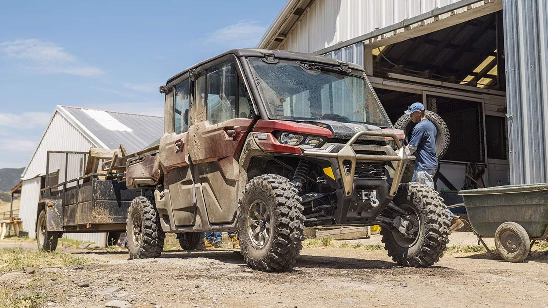 Can Am Defender towing a trailer loaded