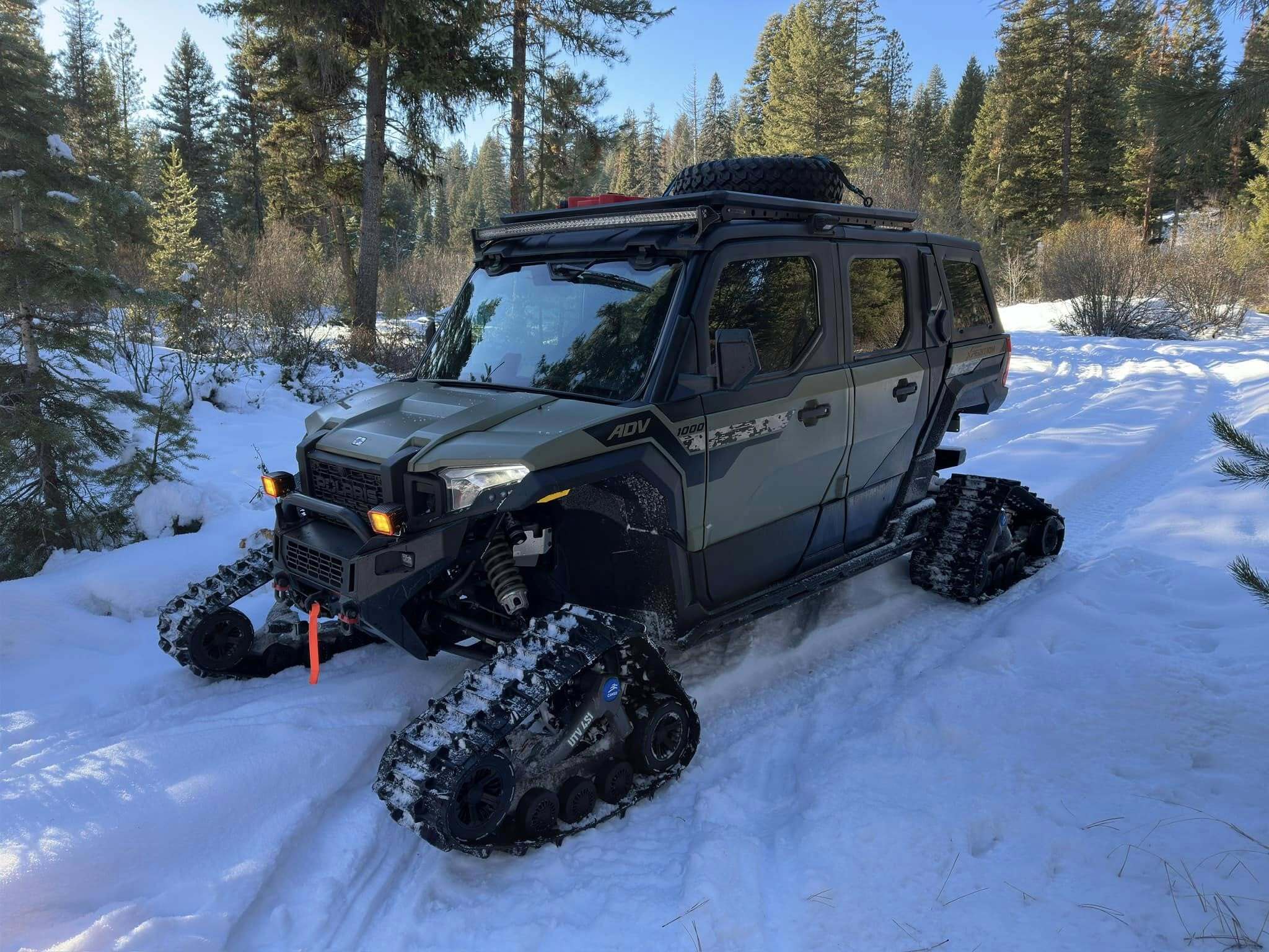 UTV Equipped for Winter Snow Adventures A fully outfitted UTV navigates a snowy trail, equipped with specialized winter accessories like a snow plow and tire chains. The vehicle’s setup highlights its versatility for clearing paths, hauling gear, or tackling rugged winter terrain with confidence and control.