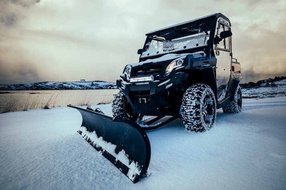 Fully Equipped UTV Ready for Winter Terrain A UTV decked out with snow tracks, a plow, cab enclosure, and roof tackles deep snow with ease. This fully equipped machine is built for winter performance, combining power, protection, and utility to handle everything from trail riding to heavy-duty snow clearing.