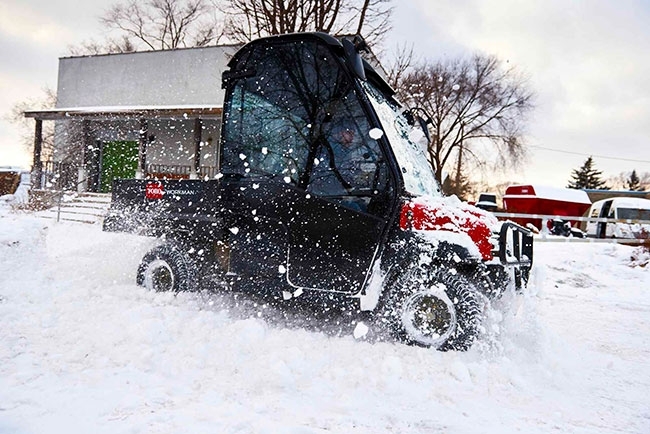 UTV Powering Through Deep Snow A rugged UTV charges through thick, powdery snow, kicking up a spray of white as it forges ahead. The scene captures the vehicle’s strength and traction, showcasing its ability to conquer challenging winter terrain with confidence and control.